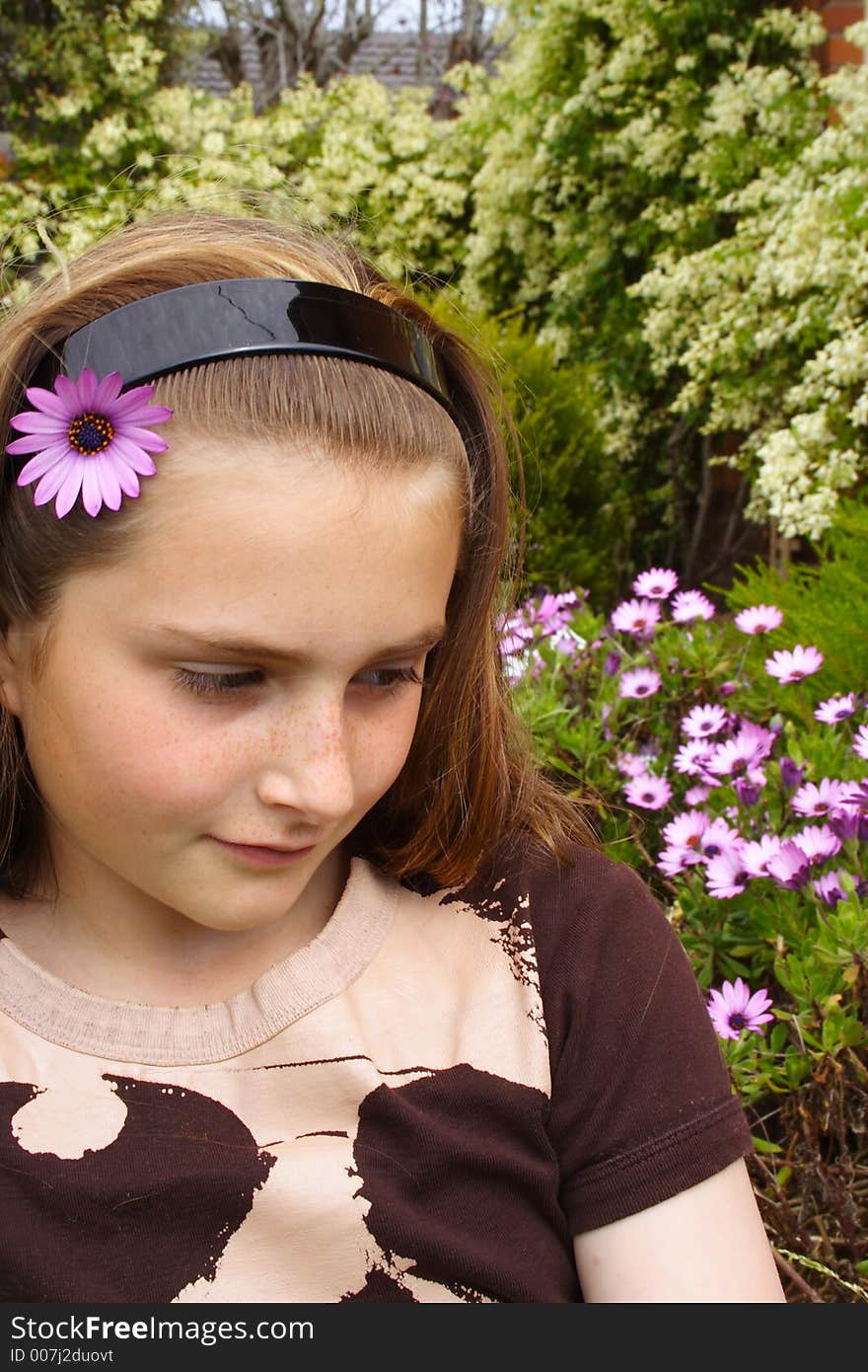 Beautiful young girl with flower in hair. Beautiful young girl with flower in hair