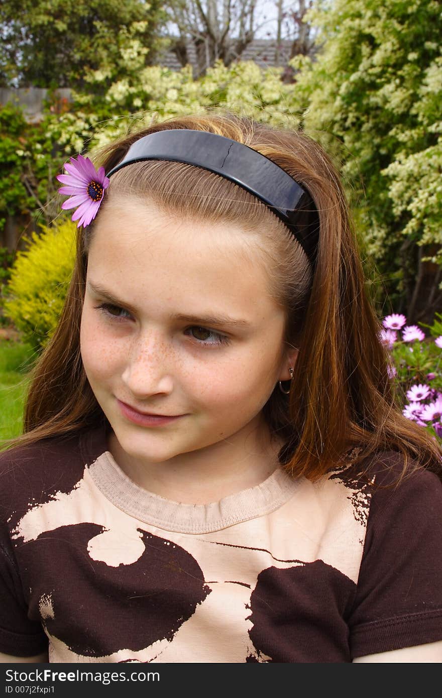 Beautiful young girl with flower in hair. Beautiful young girl with flower in hair