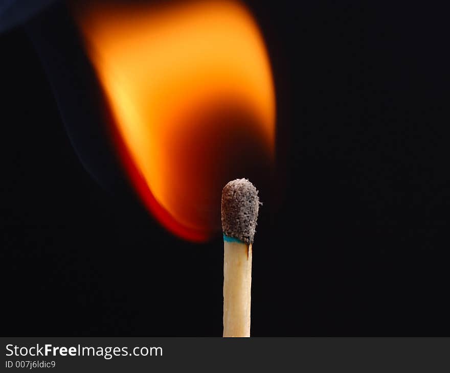 Closeup shot of a match just ignited. Closeup shot of a match just ignited