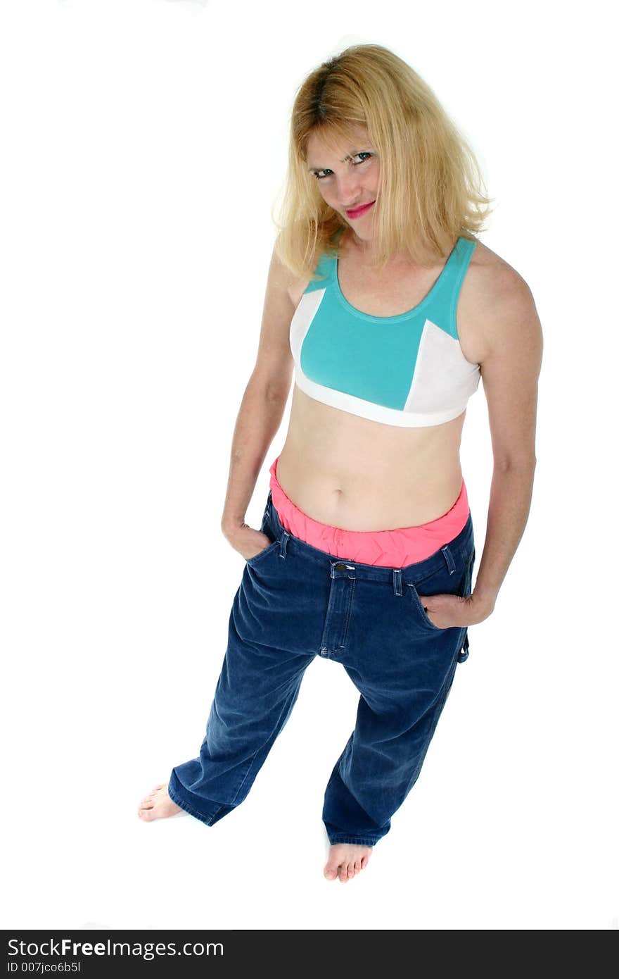 Beautiful Freshly Skinny Blonde Middle Aged Woman Excited about losing weight and inches as shown by her former pair of pants in which she immitates her teenage son. Beautiful Freshly Skinny Blonde Middle Aged Woman Excited about losing weight and inches as shown by her former pair of pants in which she immitates her teenage son.