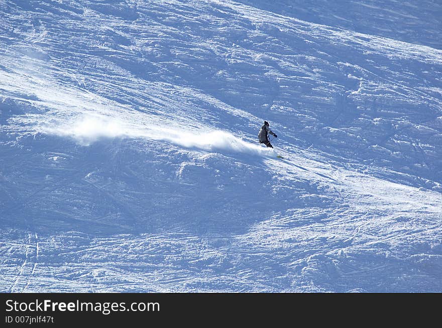 Mountain-skier on flank of hill