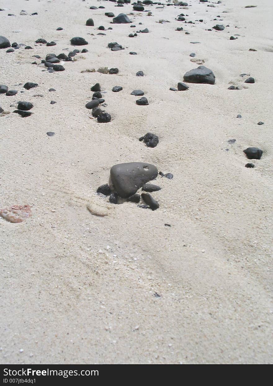 Stoney tropical beach at low tide. Stoney tropical beach at low tide