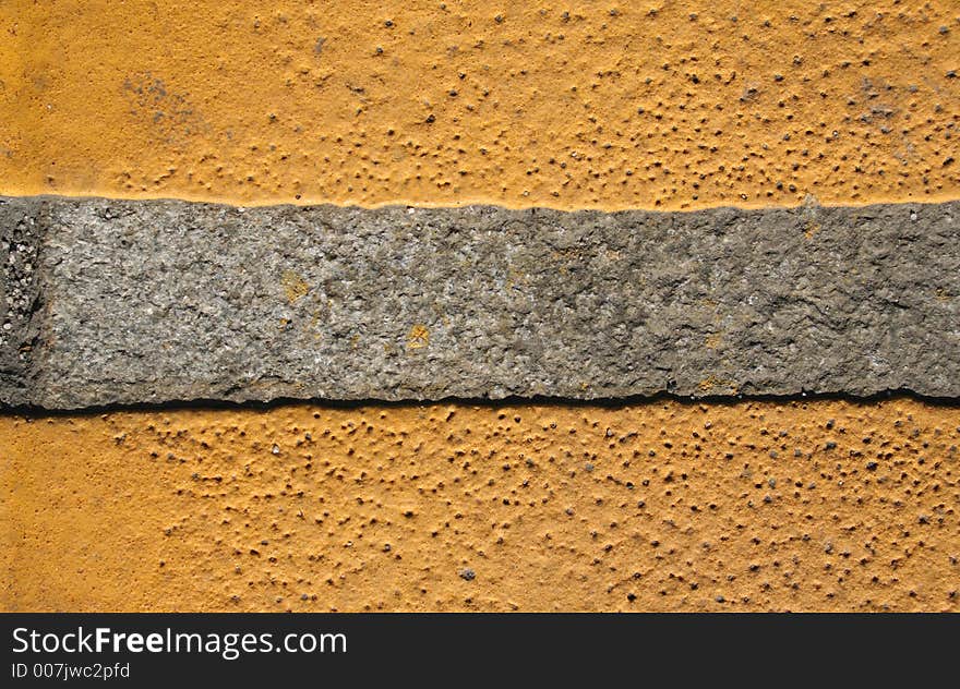 An abstract series with yellow paint on the grey pavement. An abstract series with yellow paint on the grey pavement