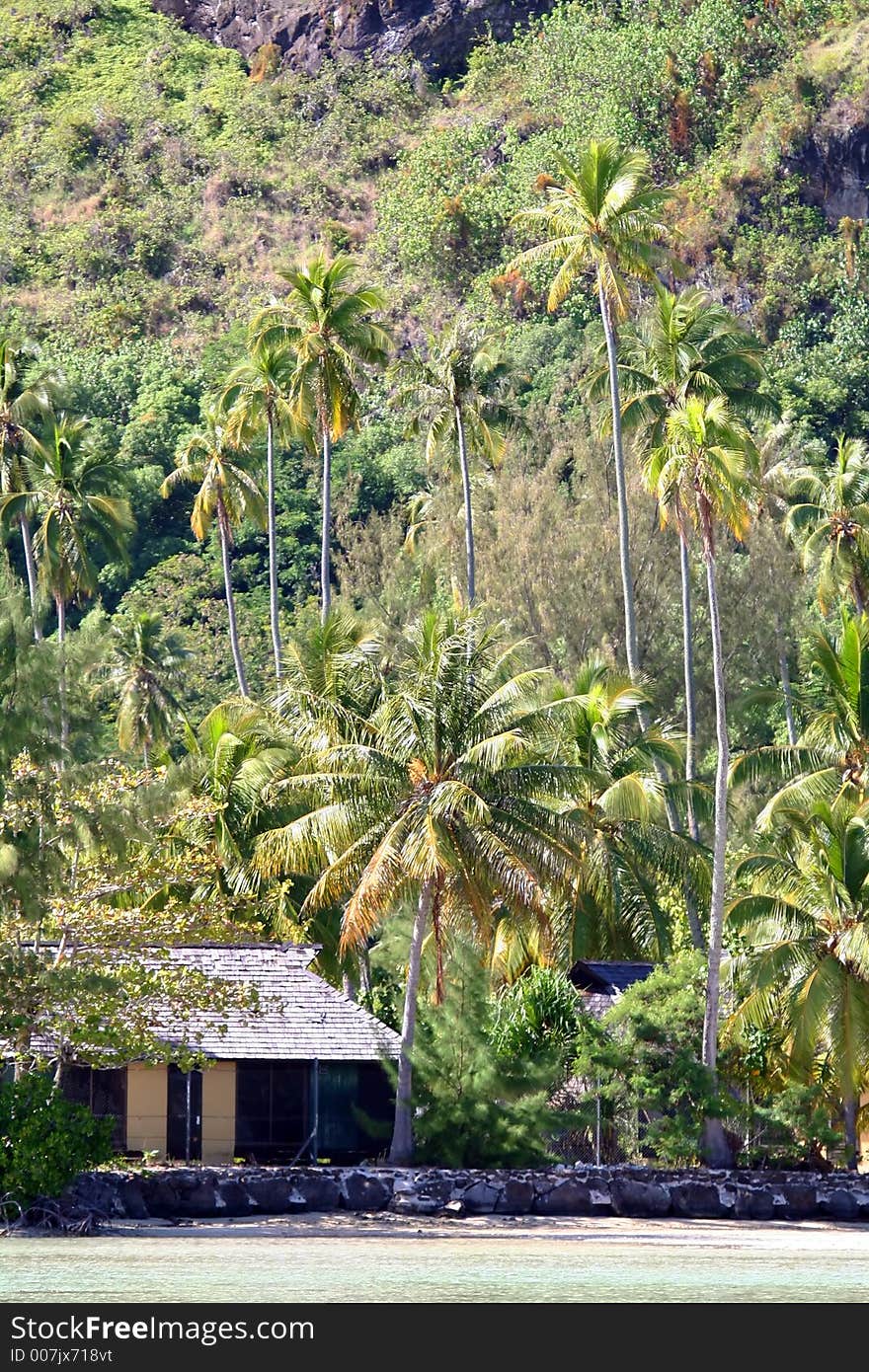 Tropical house on the beach, along the lagoon