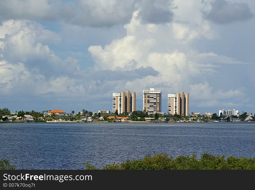 High Rise Apartment Buildings with storm coming in behind them across from Boca Ceiga Millinum Park, Seminole Florida. High Rise Apartment Buildings with storm coming in behind them across from Boca Ceiga Millinum Park, Seminole Florida