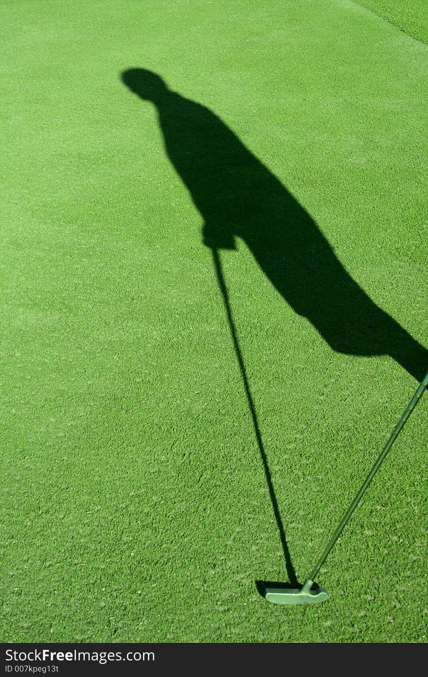 Picture of a shadow of a golfer with club. Picture of a shadow of a golfer with club