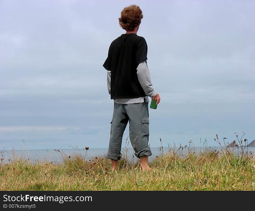 A boy on a cliff. A boy on a cliff