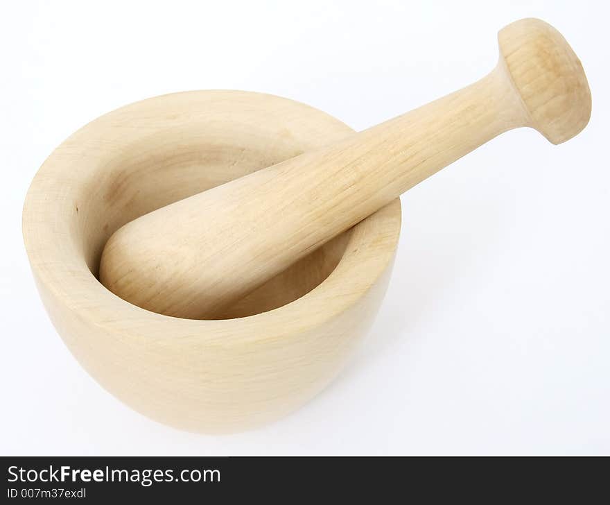 Female hand grinding the mortar and pestle, over white, macro closeup, close-up with copy space. Female hand grinding the mortar and pestle, over white, macro closeup, close-up with copy space.