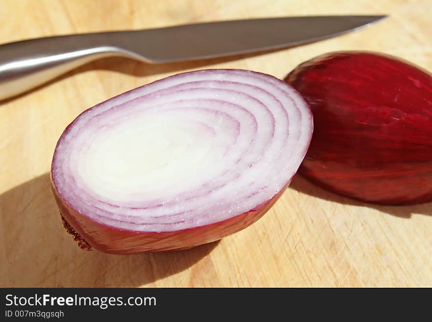 Onions on chopping board, macro close up with copy-space, copy space. Onions on chopping board, macro close up with copy-space, copy space.