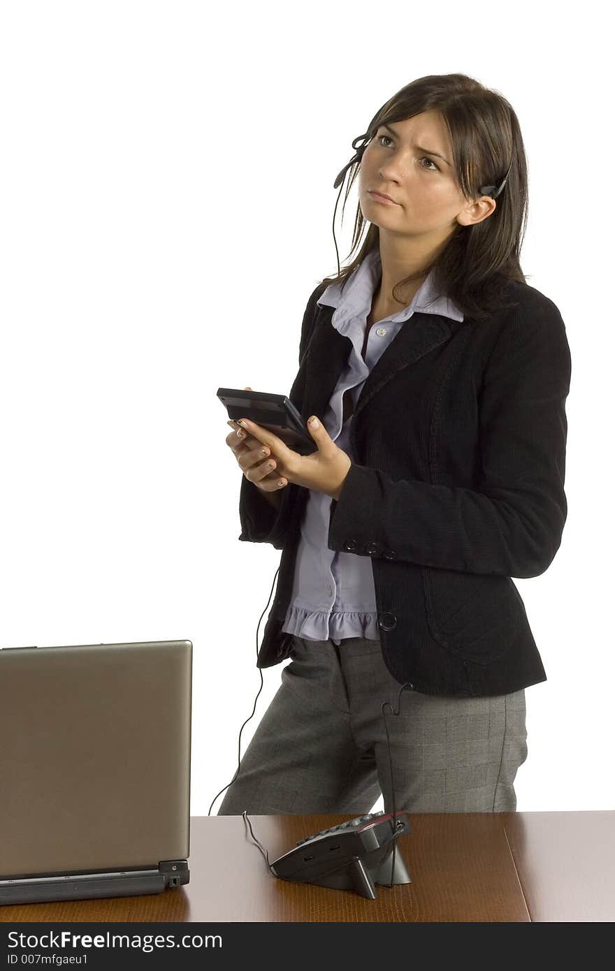 Isolated female office worker with calculator - thinking