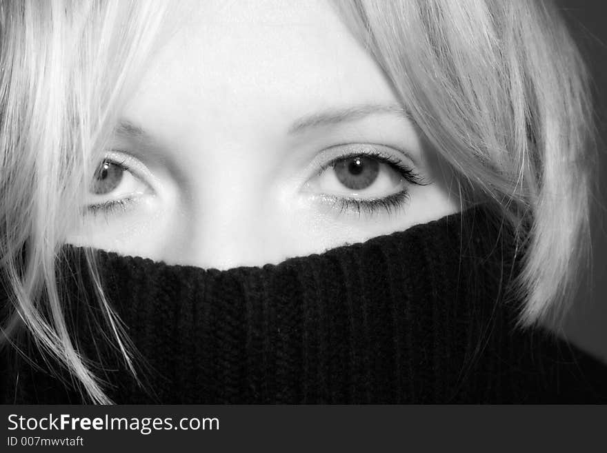 Close up of a woman behind a pullover. Close up of a woman behind a pullover