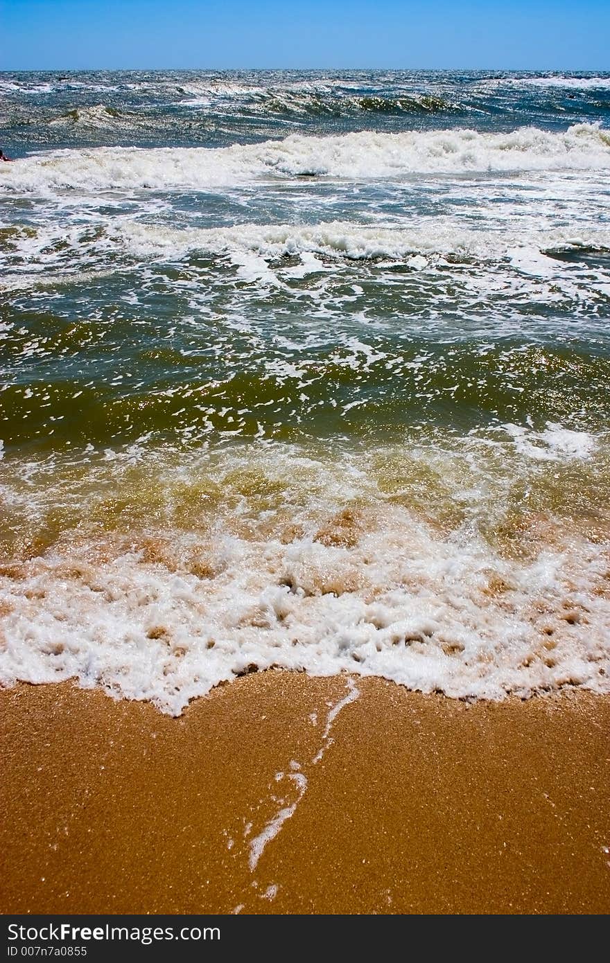Sea waves on beaches, sands, foam