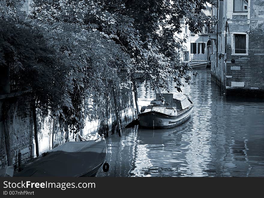 A sepia tone and artistic view down one of the canals in Venice. A sepia tone and artistic view down one of the canals in Venice.