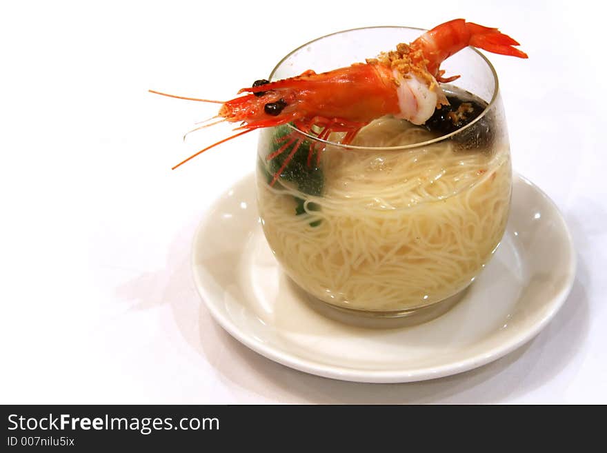 Prawn noodles in a glass bowl