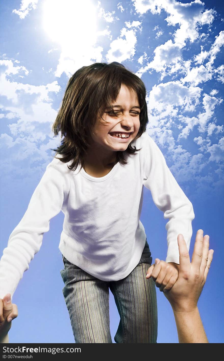 Little girl jumping high over blue sky. Little girl jumping high over blue sky