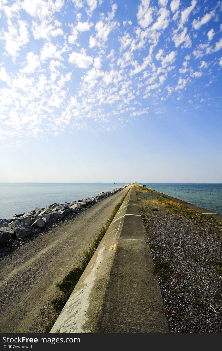 Path in the ocean with clouds