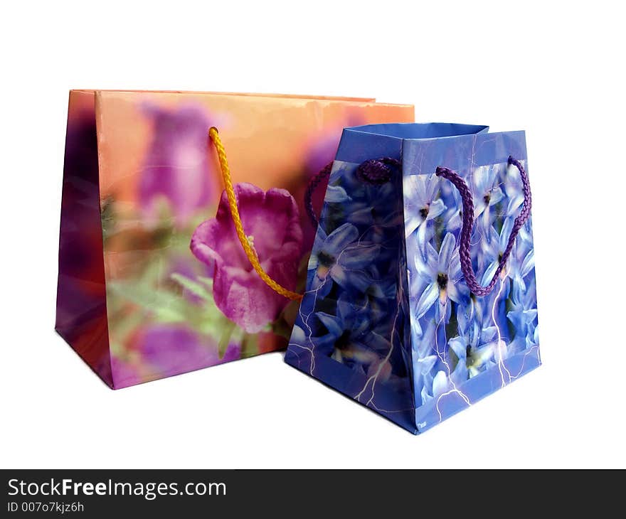 Brightly colored shopping bags isolated over a white background