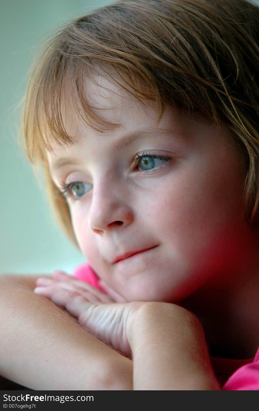 Window Portrait Of Little Girl Looking Out Window