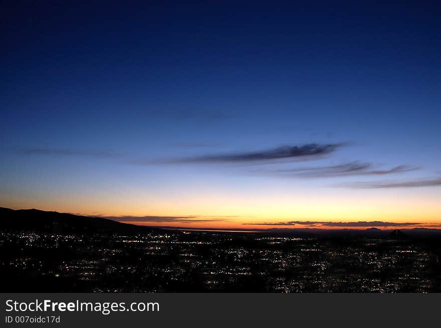 Sunrise or sunset over city with lights. Sunrise or sunset over city with lights