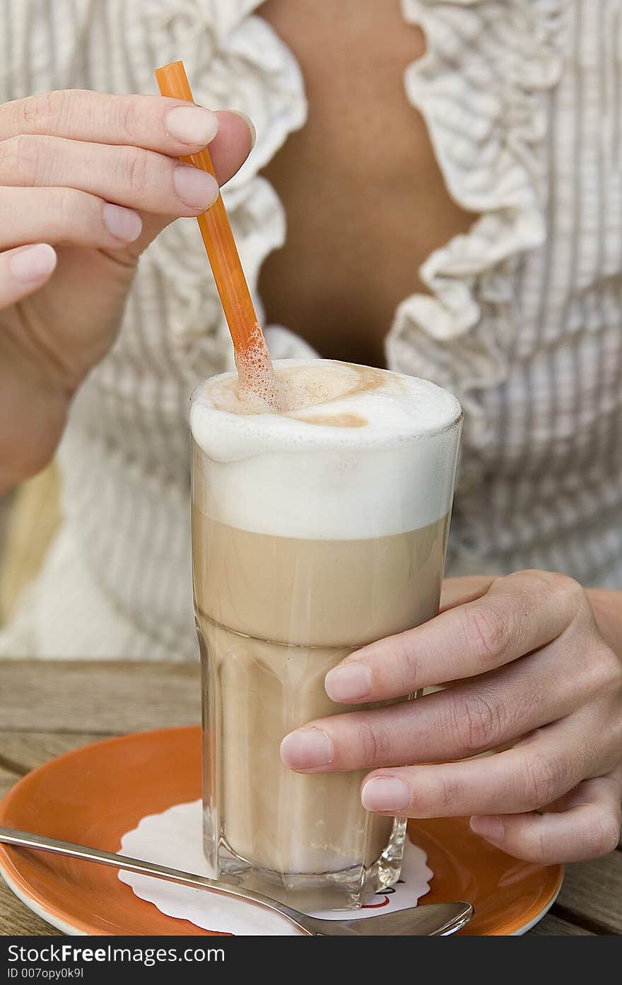 Caffe latte in glass in cafe