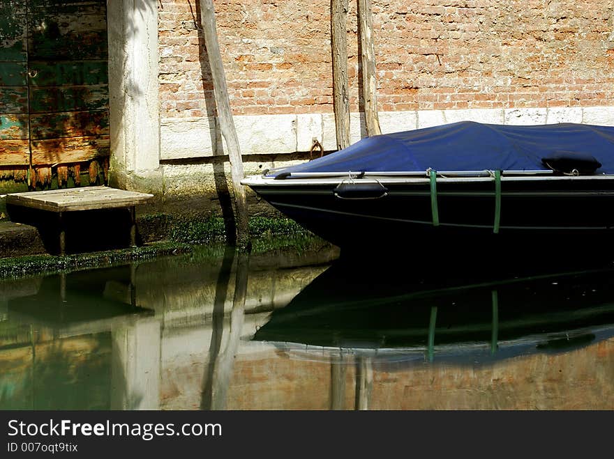 A picturesque back street canal in Venice. A picturesque back street canal in Venice.