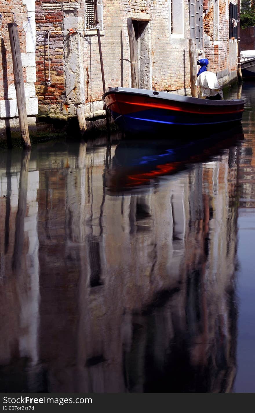 A lovely reflection from the coloured strips on the boat. A lovely reflection from the coloured strips on the boat.