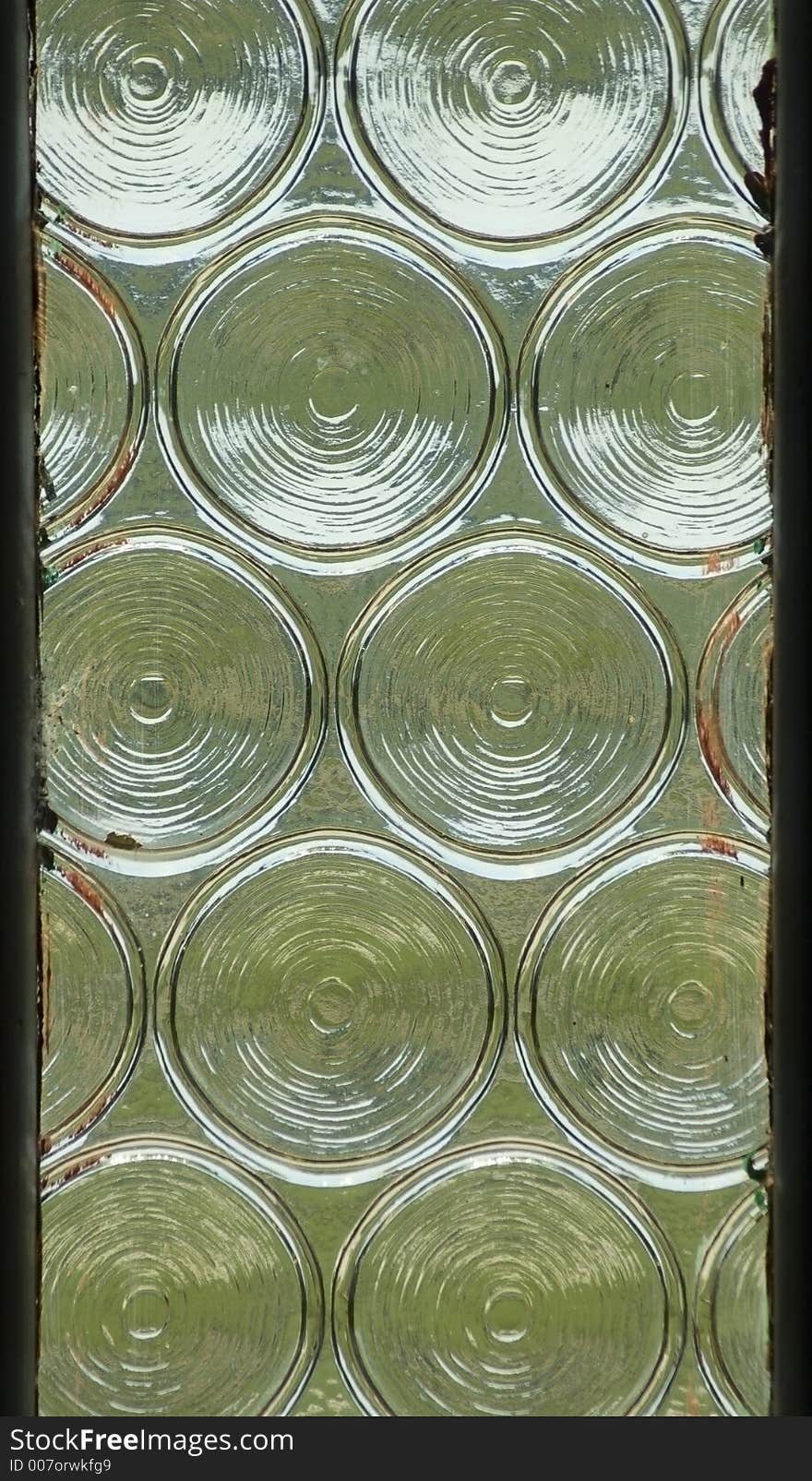 Window Panel With Circular Impressions In Glass