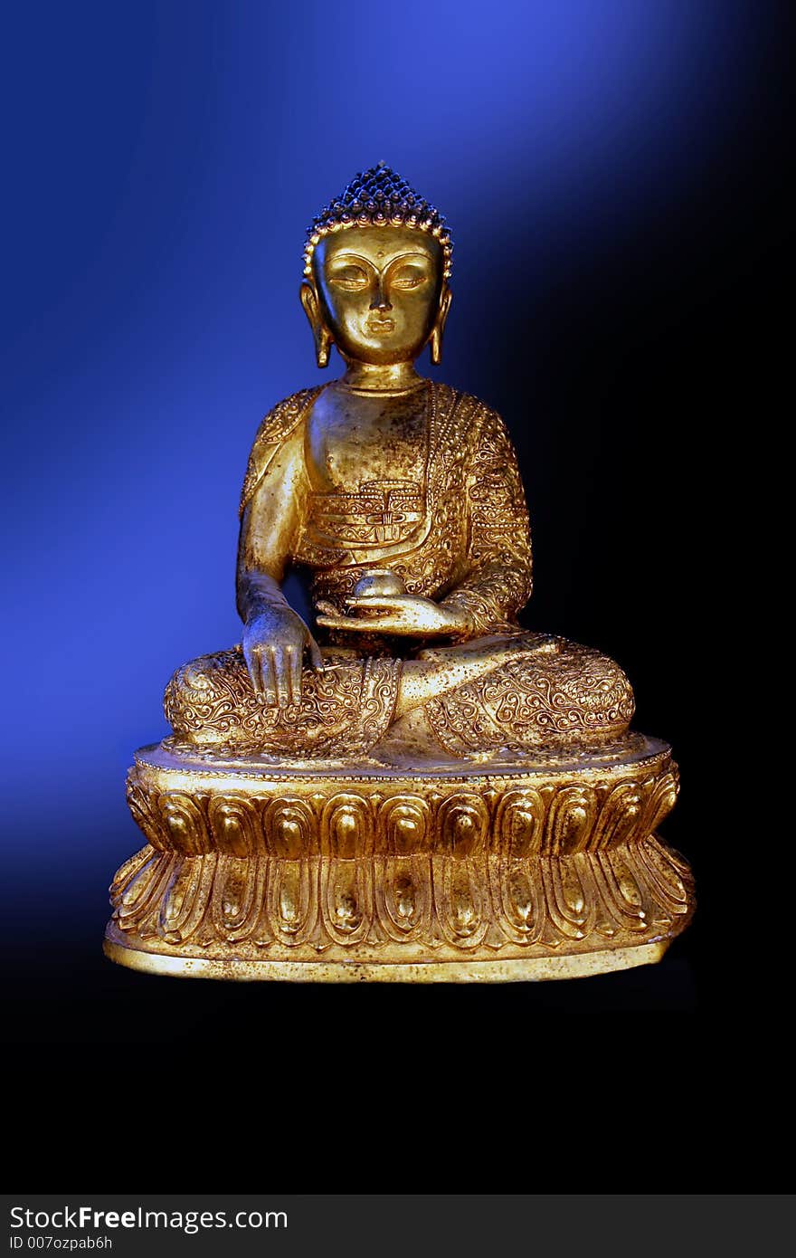 Bronze Buddha against a surreal, colored background space