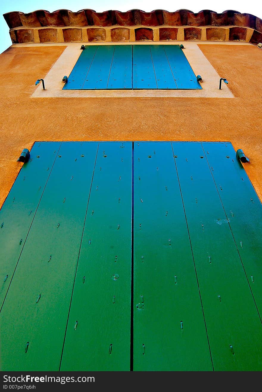 Colourful windows at the village of Rossillion in France, with its ochre tinted walls