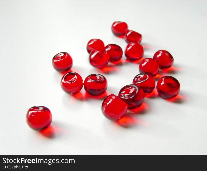 Small red round pills. Small red round pills