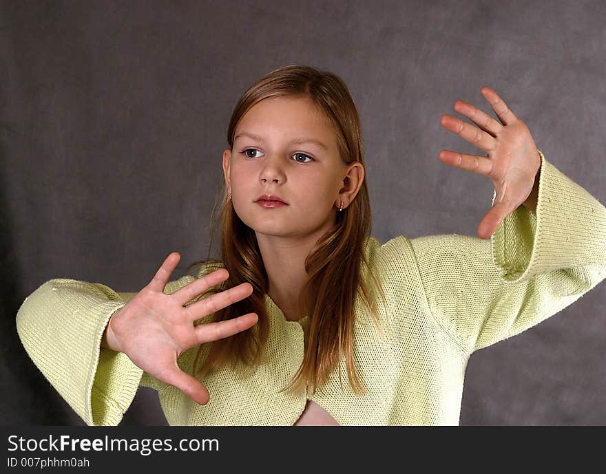 The beautiful girl in a yellow sweater. The beautiful girl in a yellow sweater