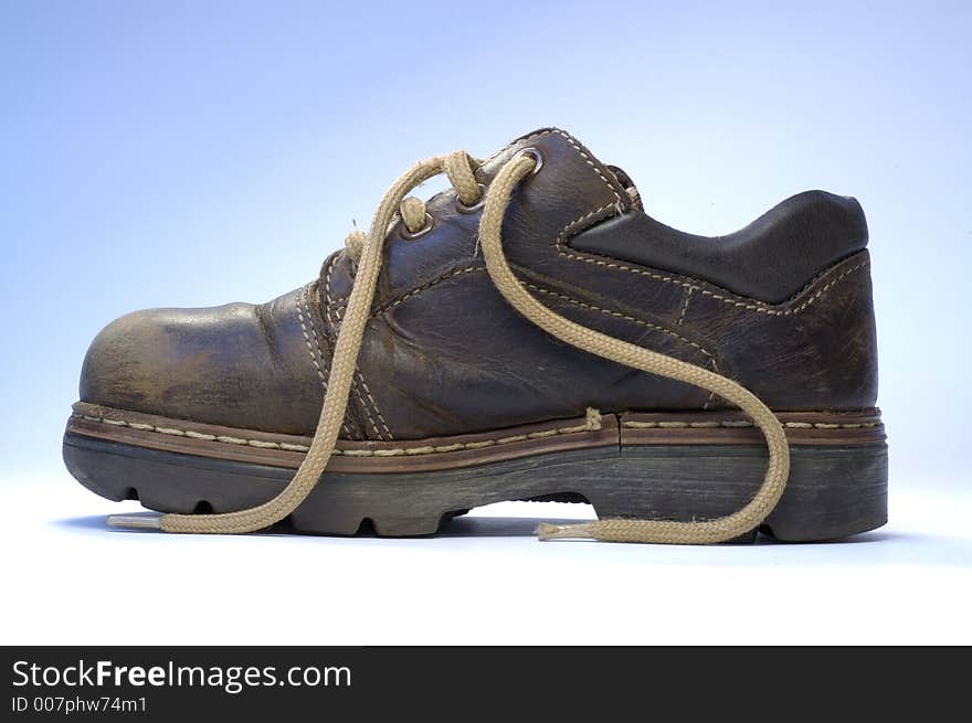 One children's old shoe with shoelace.