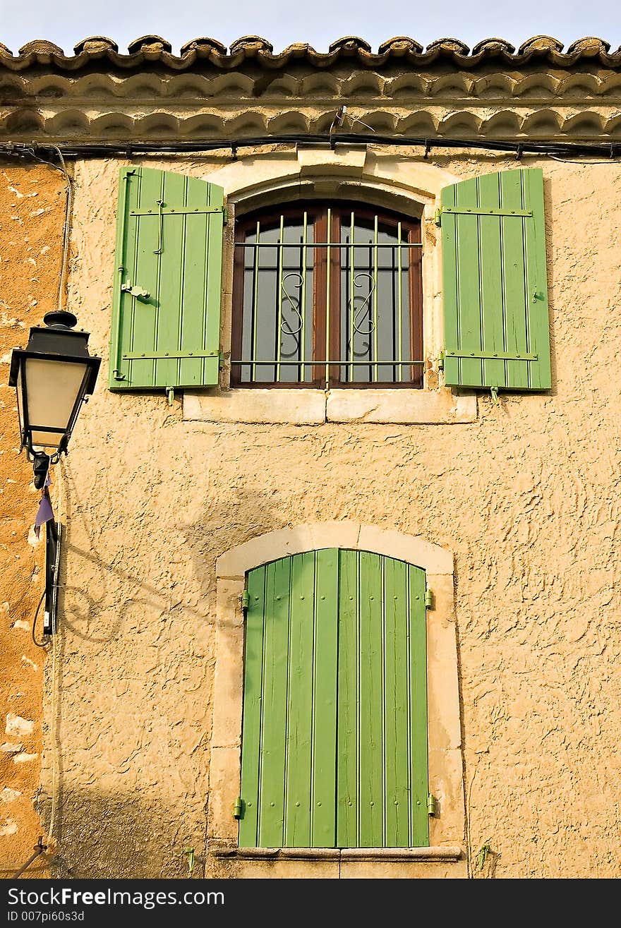 Colourful windows and doors at the village of Eyegalieres in France, with its colourful tinted walls