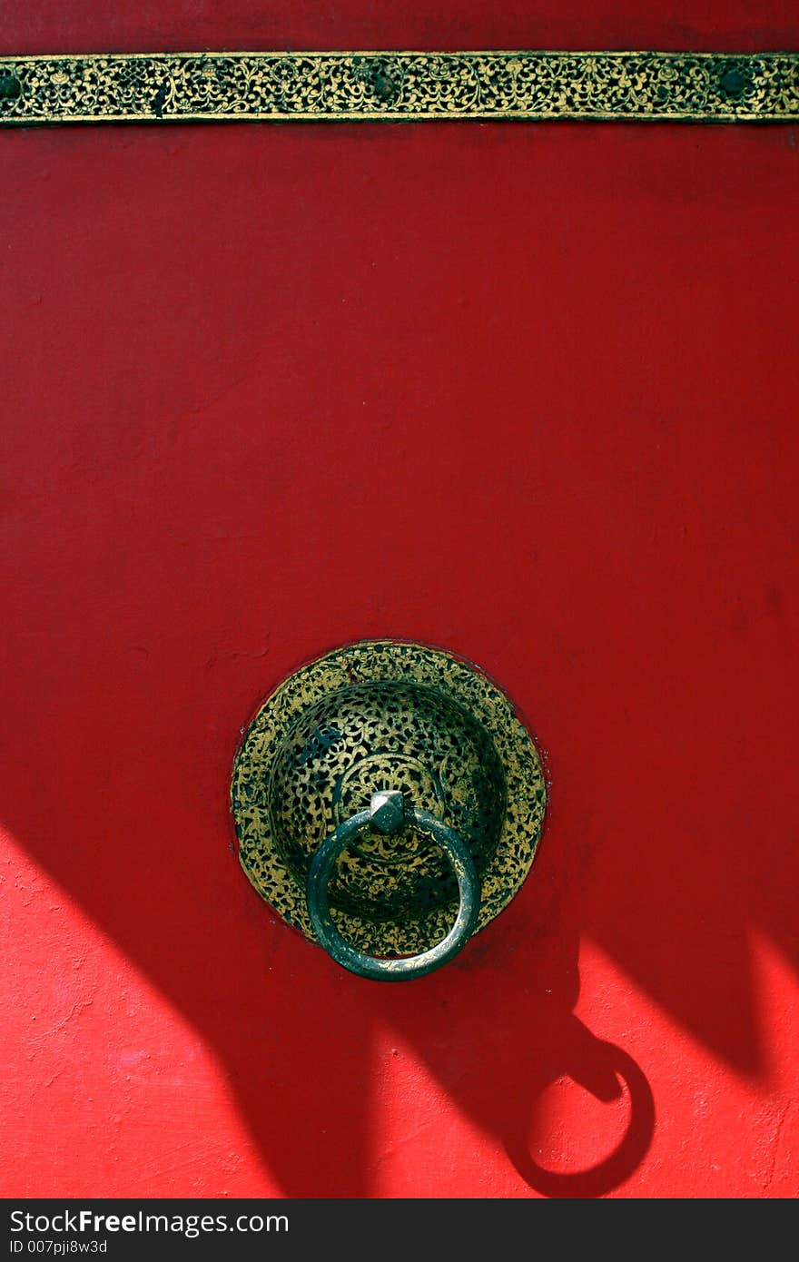 Red door with traditional doorknob. Red door with traditional doorknob.