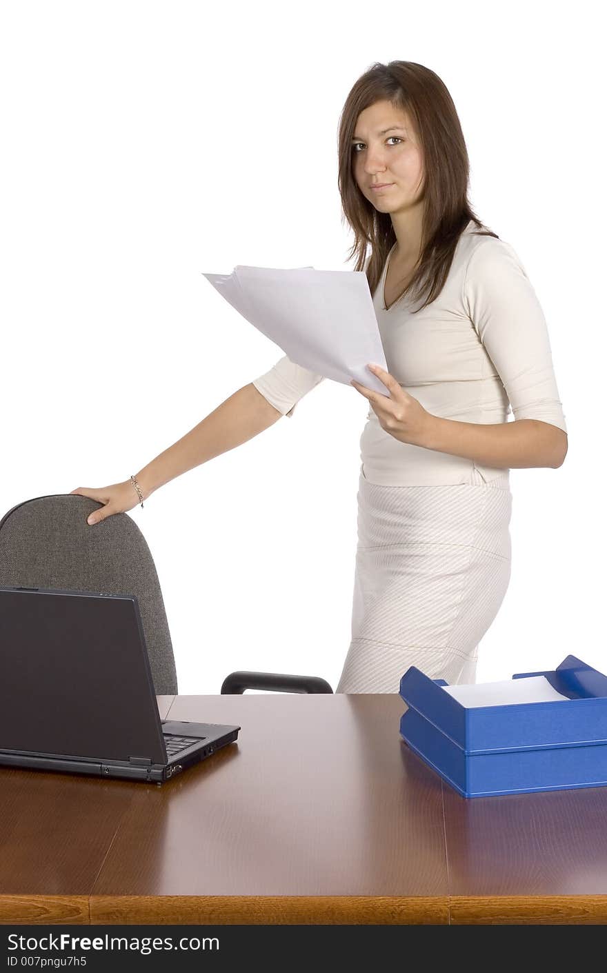 Standing businesswoman keeps papers