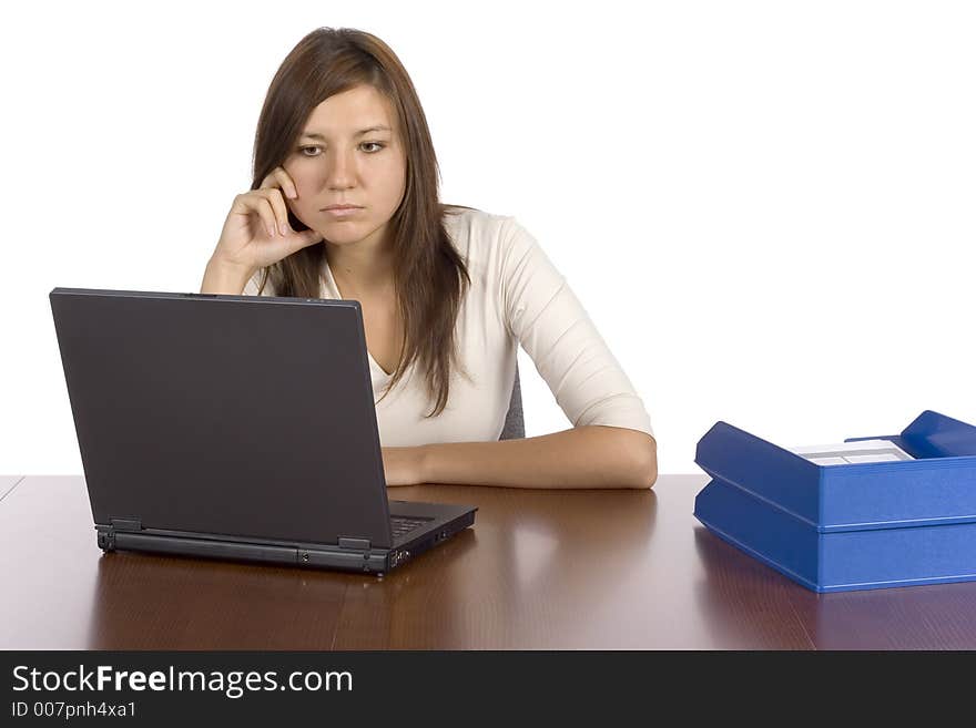 Isolated female office worker wondering at the notebook