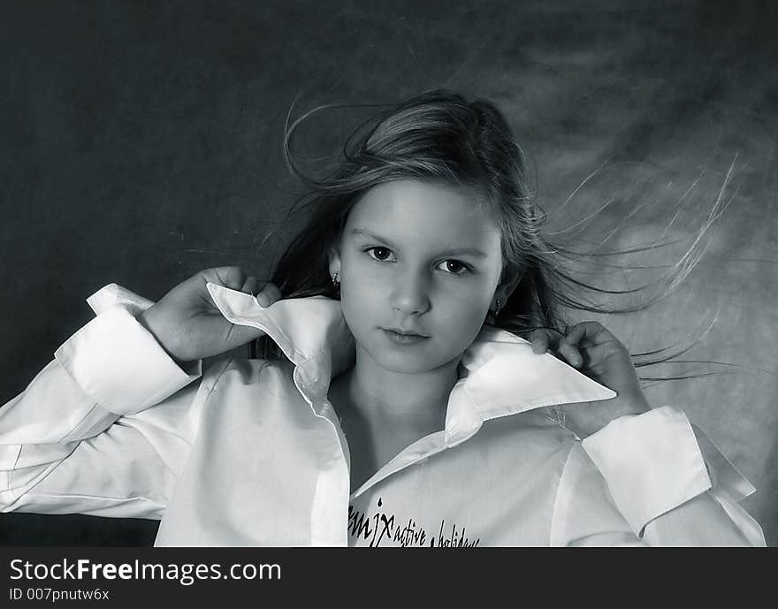 The girl holds hands for a collar, hair develop. b/w+blue tone. The girl holds hands for a collar, hair develop. b/w+blue tone