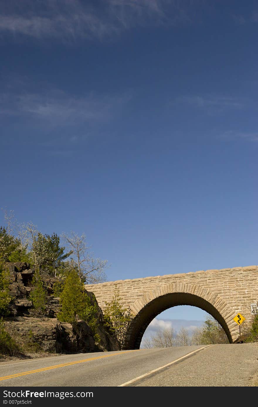 Stone bridge over tarmac road, Acadia National Park, Maine