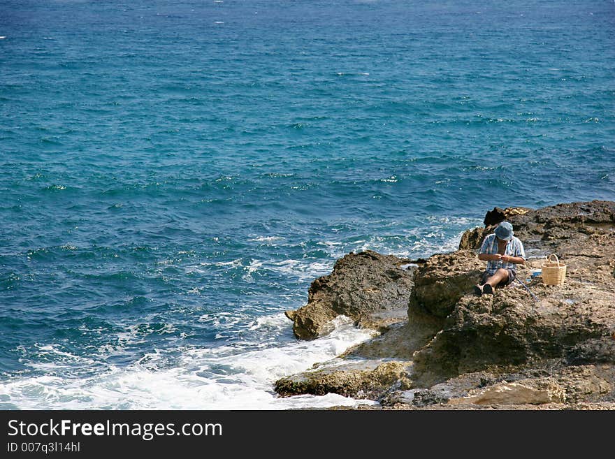 Fishman on the rocks, crete