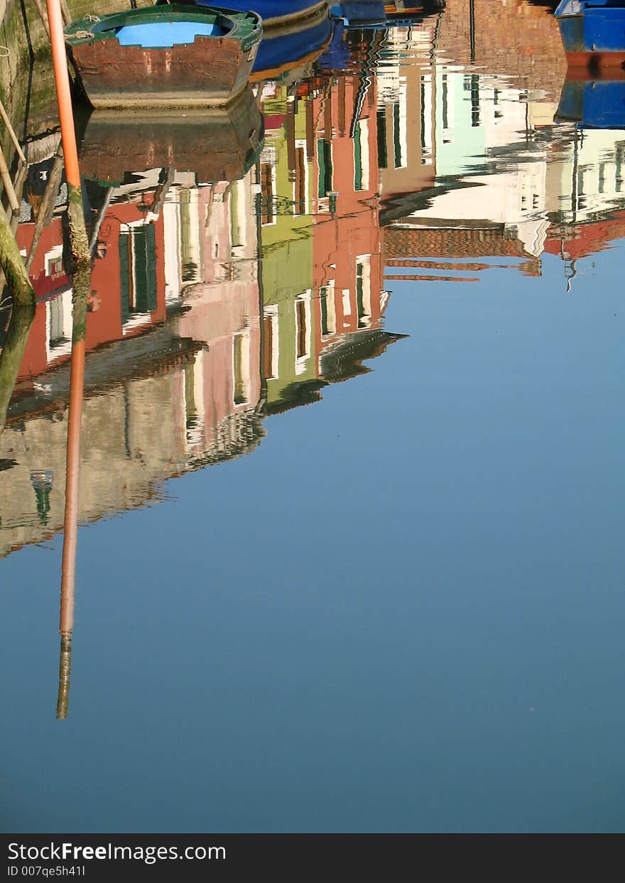 The reflection of some houses in a canal in Venice. The reflection of some houses in a canal in Venice