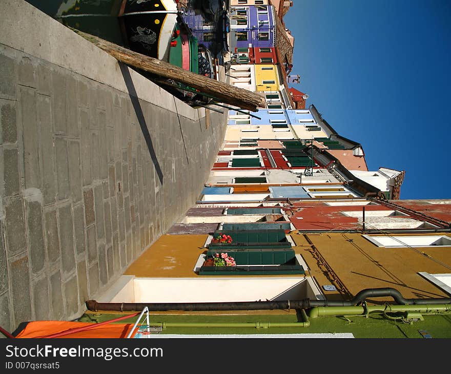 A typical street of Burano, an island in Venice