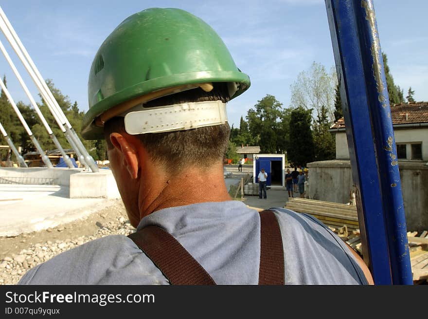 Worker on the house in th emain town of montenegro. Worker on the house in th emain town of montenegro