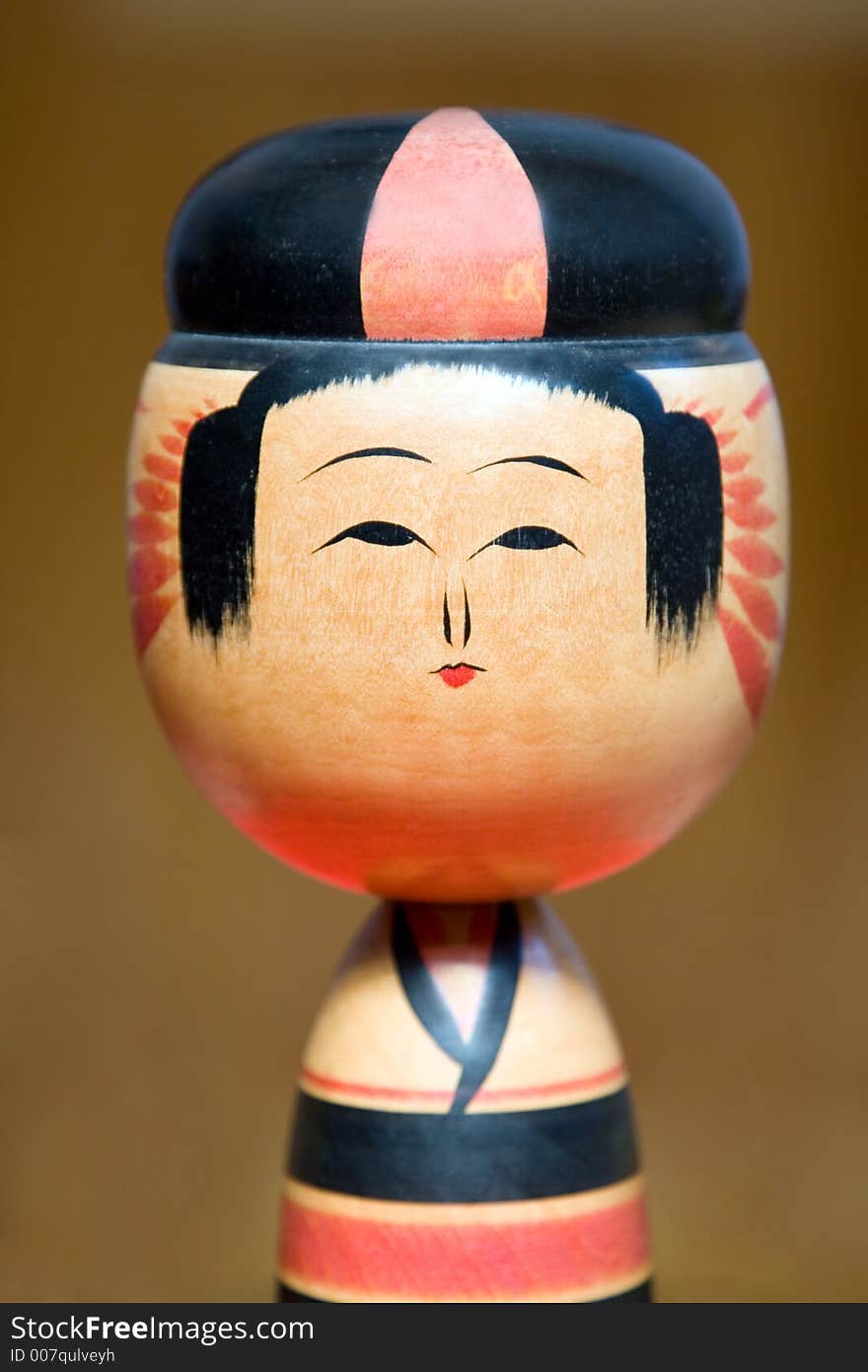 Details of a Japanese kokeshi wooden doll.