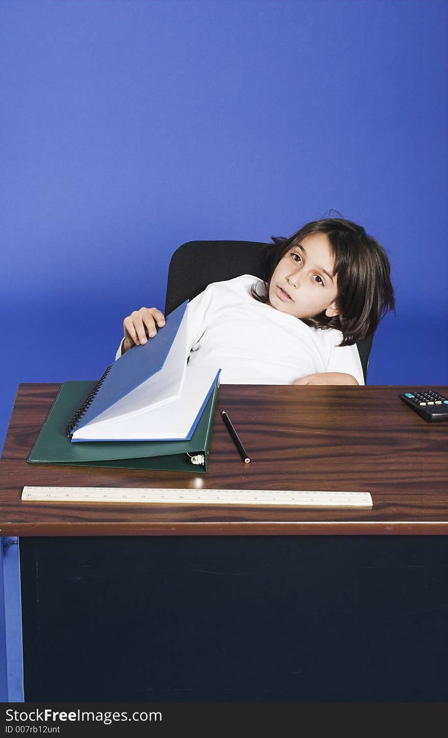 Little girl sitting in bad posture