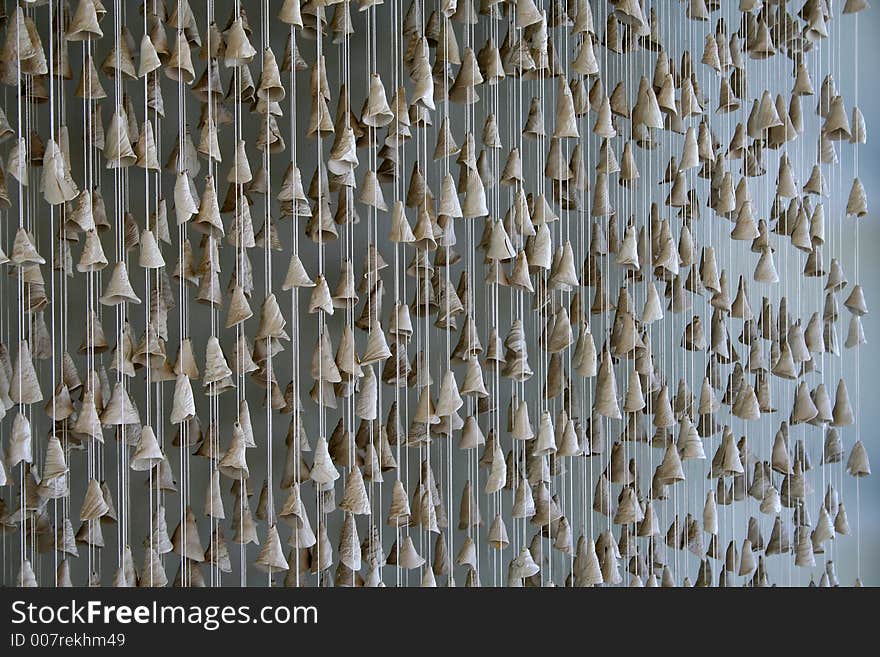 Shell chimes hanging against a wall. Shell chimes hanging against a wall