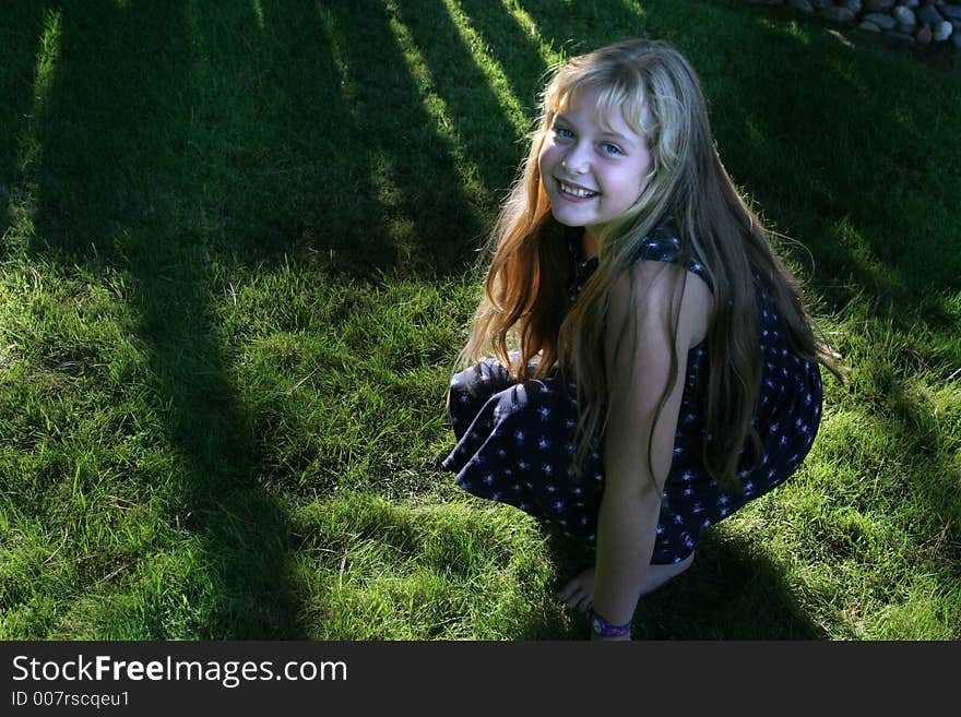 Pretty little girl on green grass. Pretty little girl on green grass