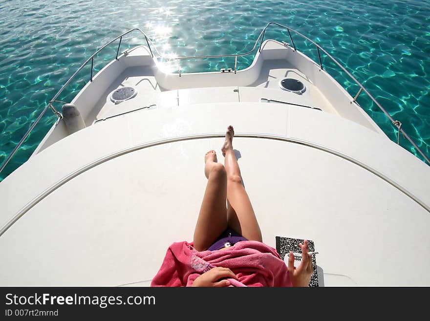 Woman legs on a boat