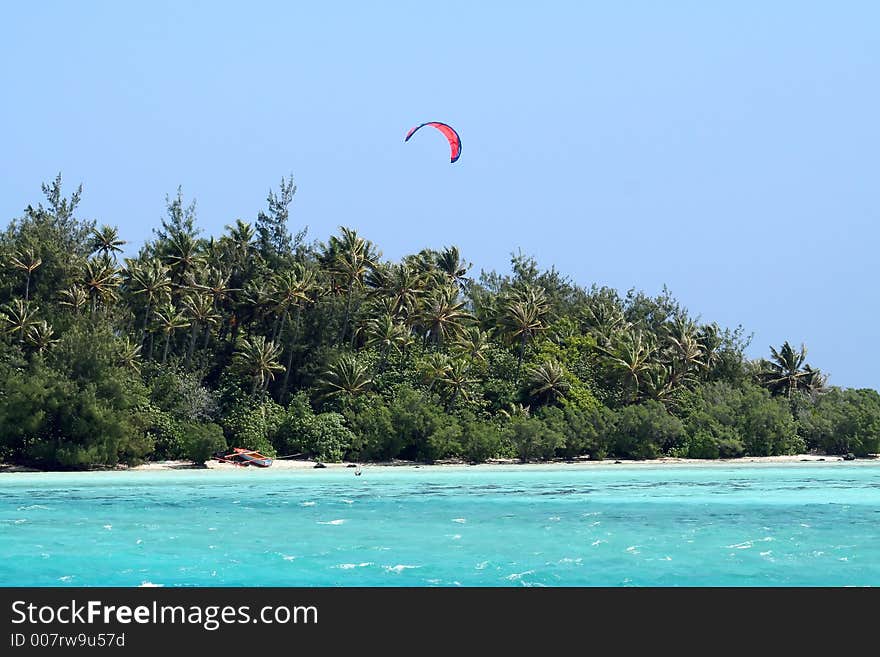 Kitesurf at waterstart on a turquoise lagoon