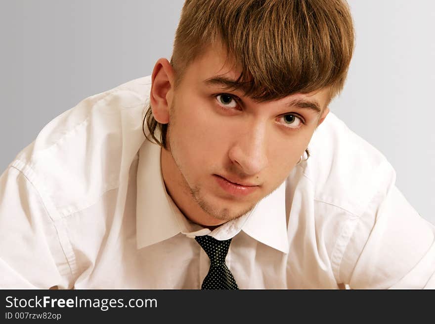 A  young man in white shirt and a tie. A  young man in white shirt and a tie.