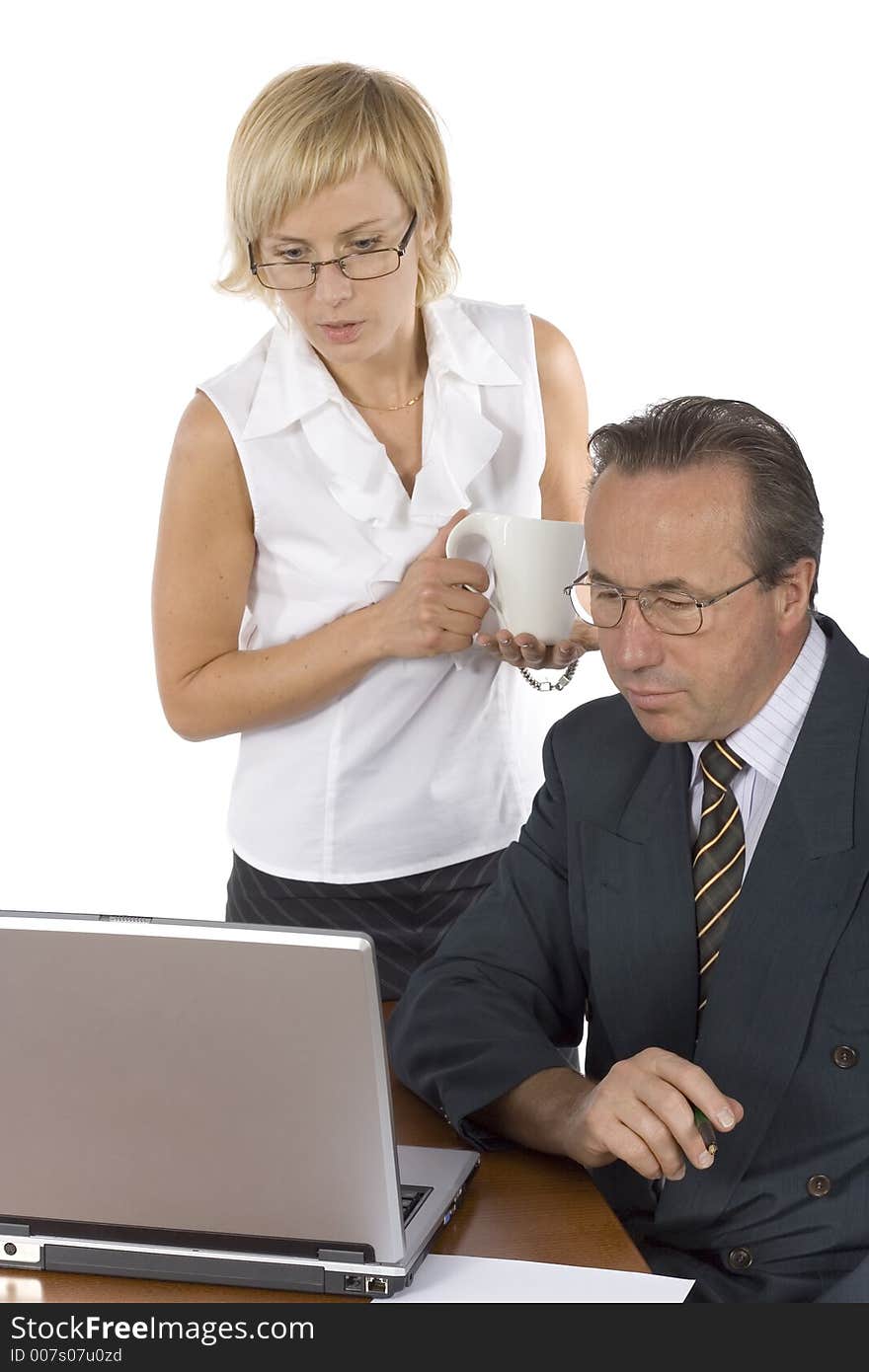 Businesspeople at the wood desk + laptop. Businesspeople at the wood desk + laptop